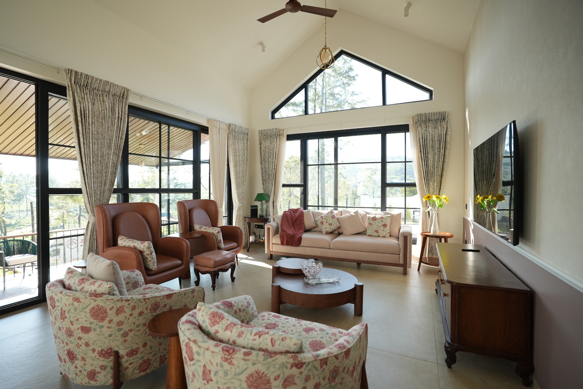 Spacious villa living room with vaulted ceiling designed by JBS Interiors